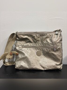 Kipling Shimmery Champagne Crossbody Bag with Monkey Charm metallic purse tote